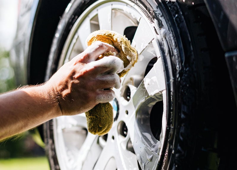 Washing a car wheel and tire by hand